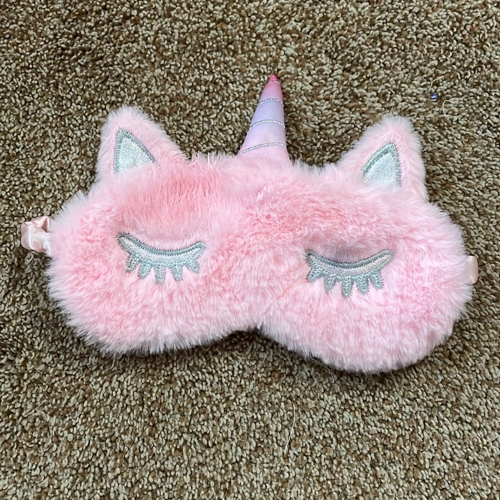 Plush pink unicorn sleep mask